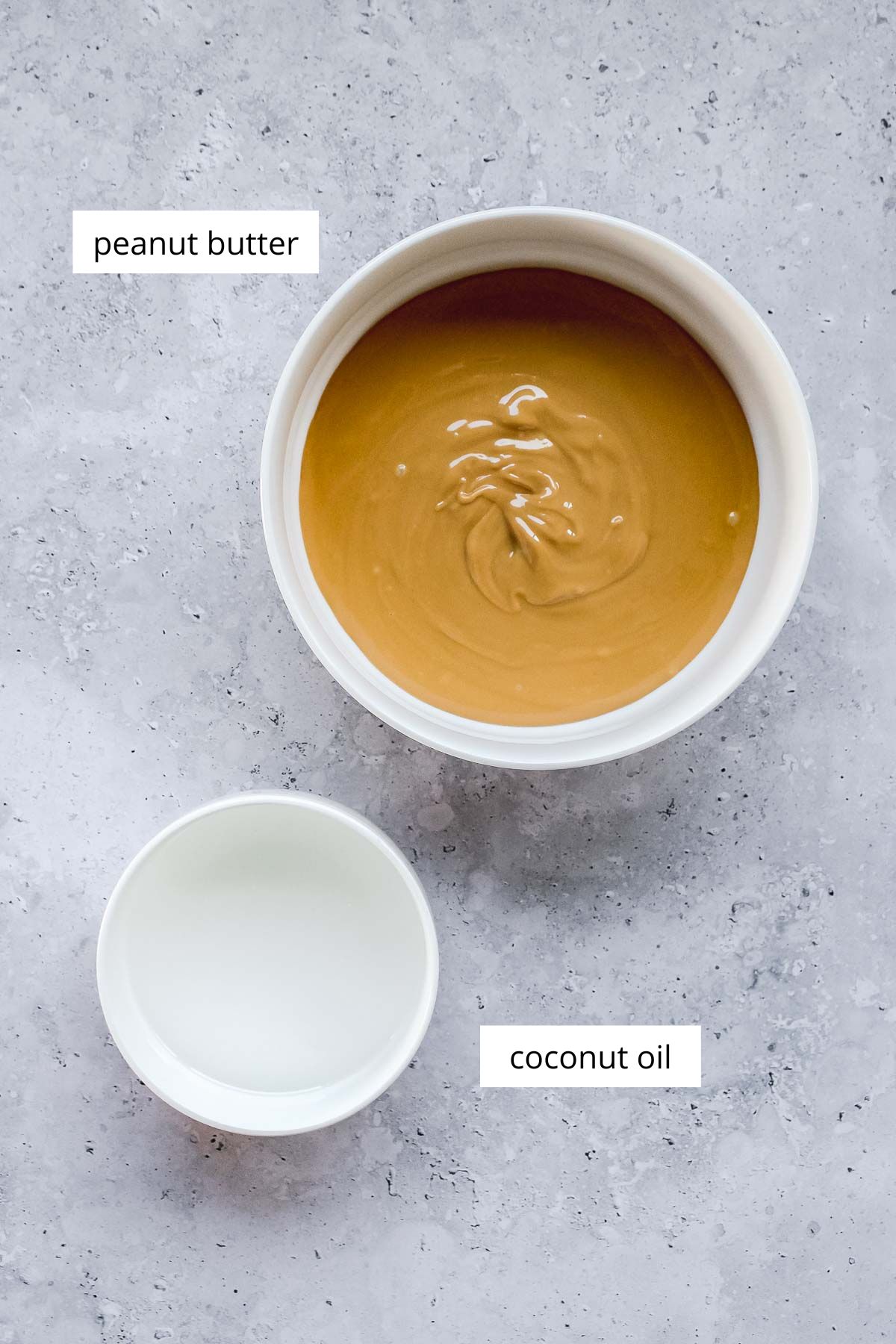 ingredients for 2 ingredient peanut butter fudge on blue background.