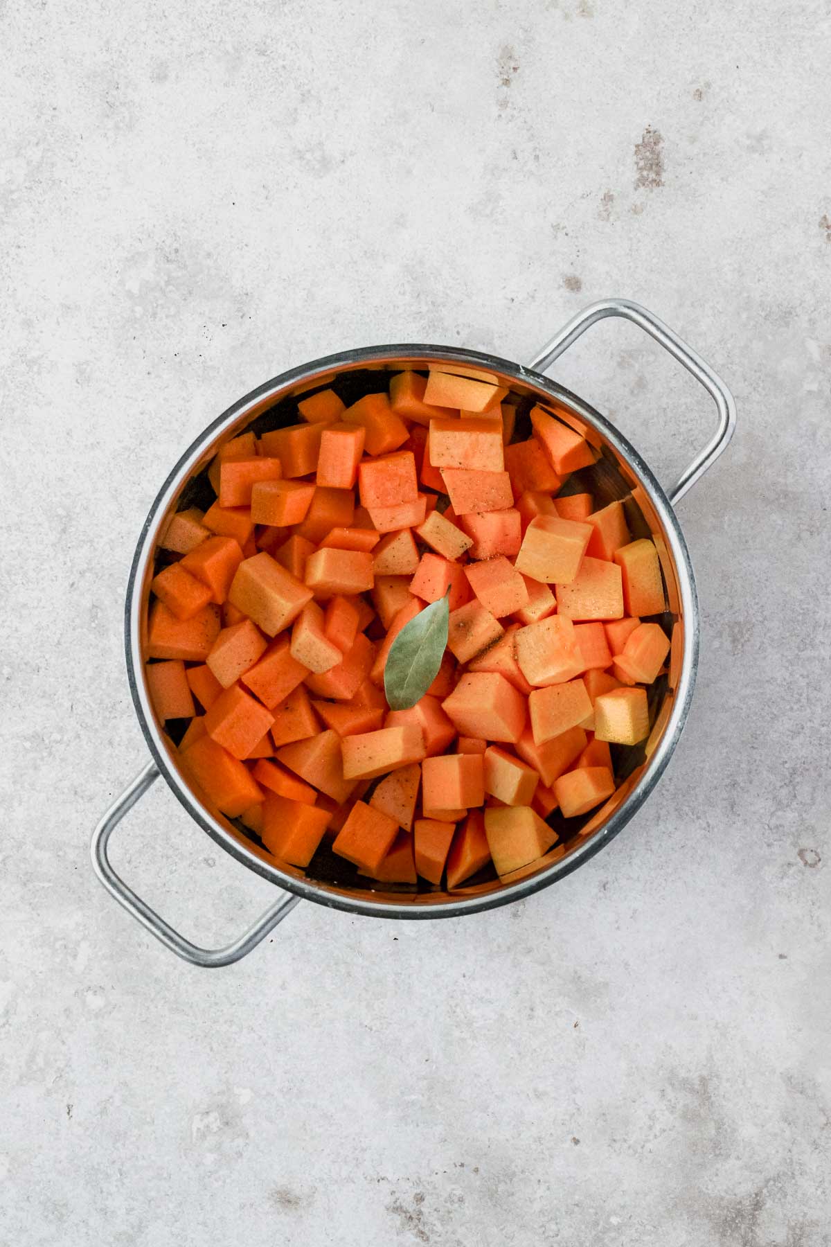 roasted pumpkin onion and garlic with spices in pot.