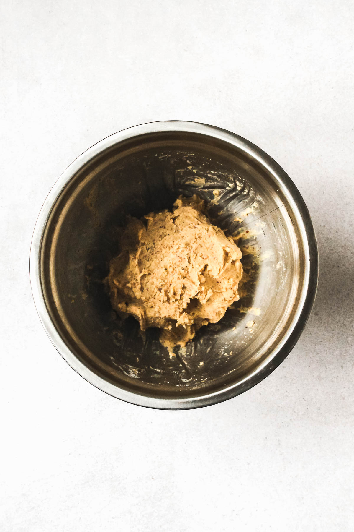 kneaded Linzer Augen dough in metal bowl.