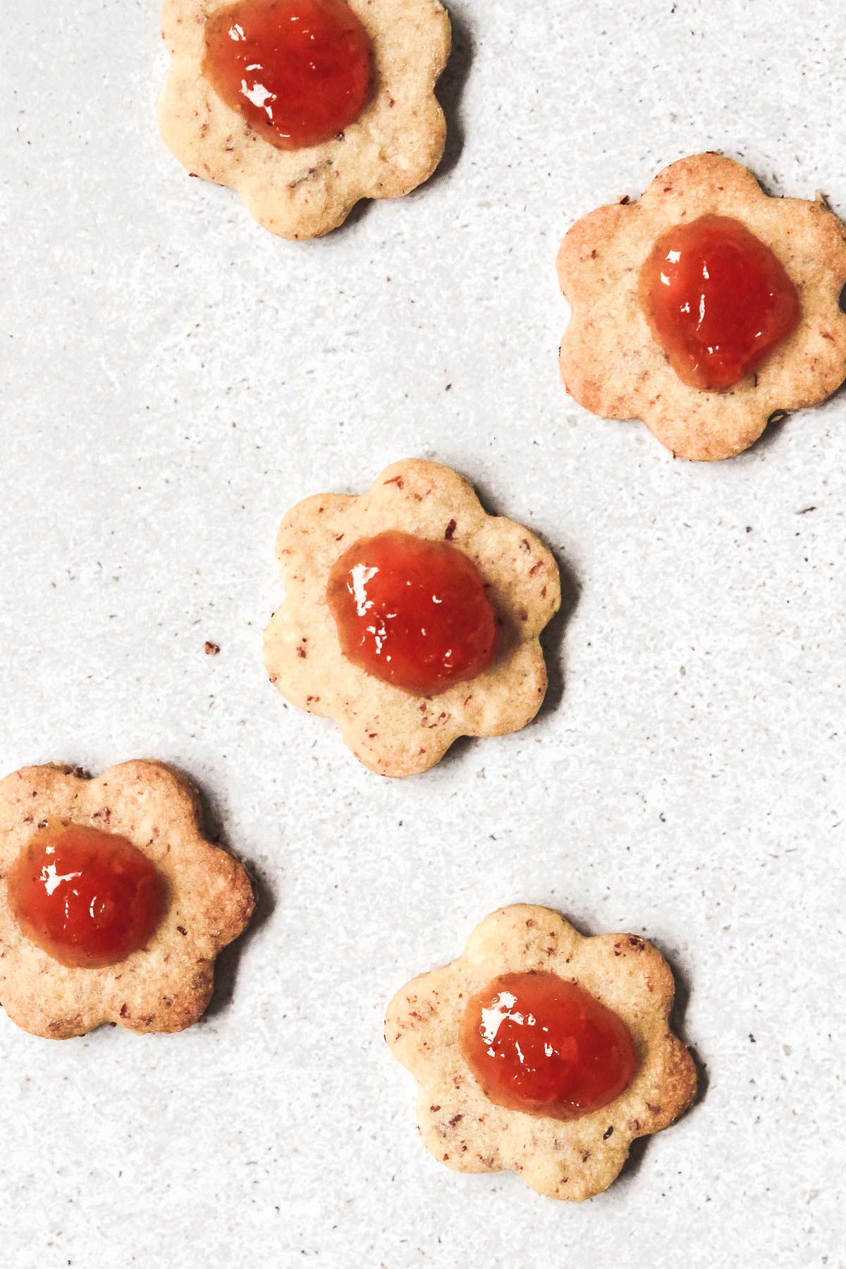 linzer cookie base with apricot jam before assembling.