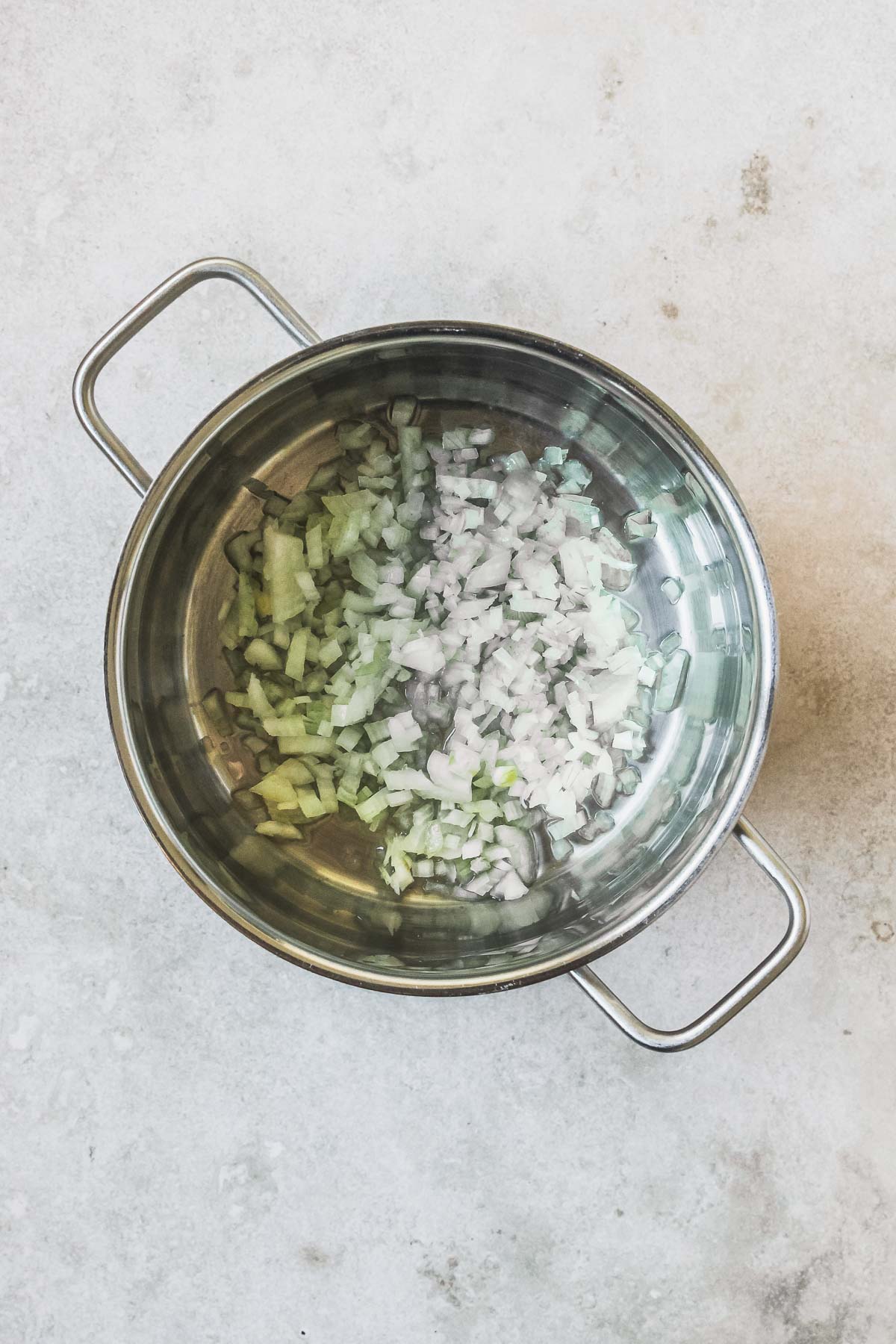 chopped onions roasting in pot.