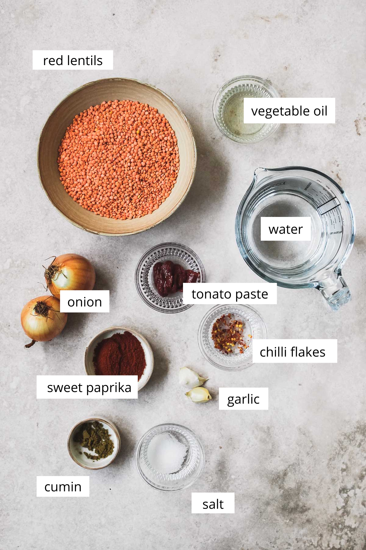 ingredients for lentil soup on vintage beige background.