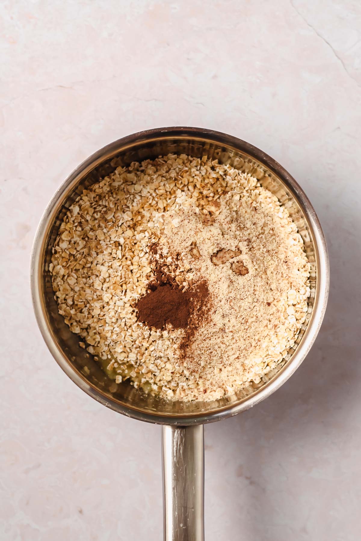 ingredients for banana oatmeal in small saucepan.