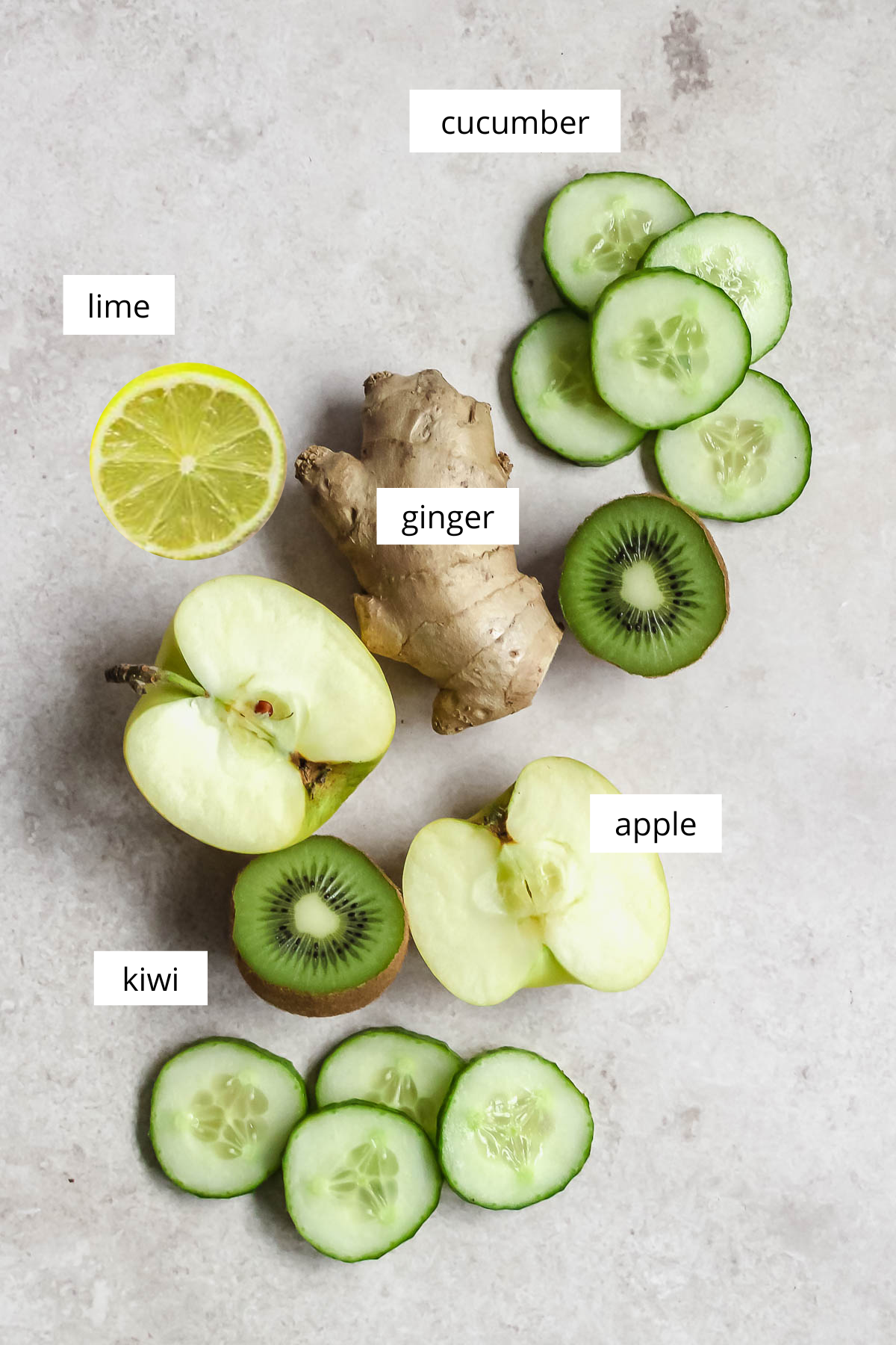 ingredients for green juice on beige background.