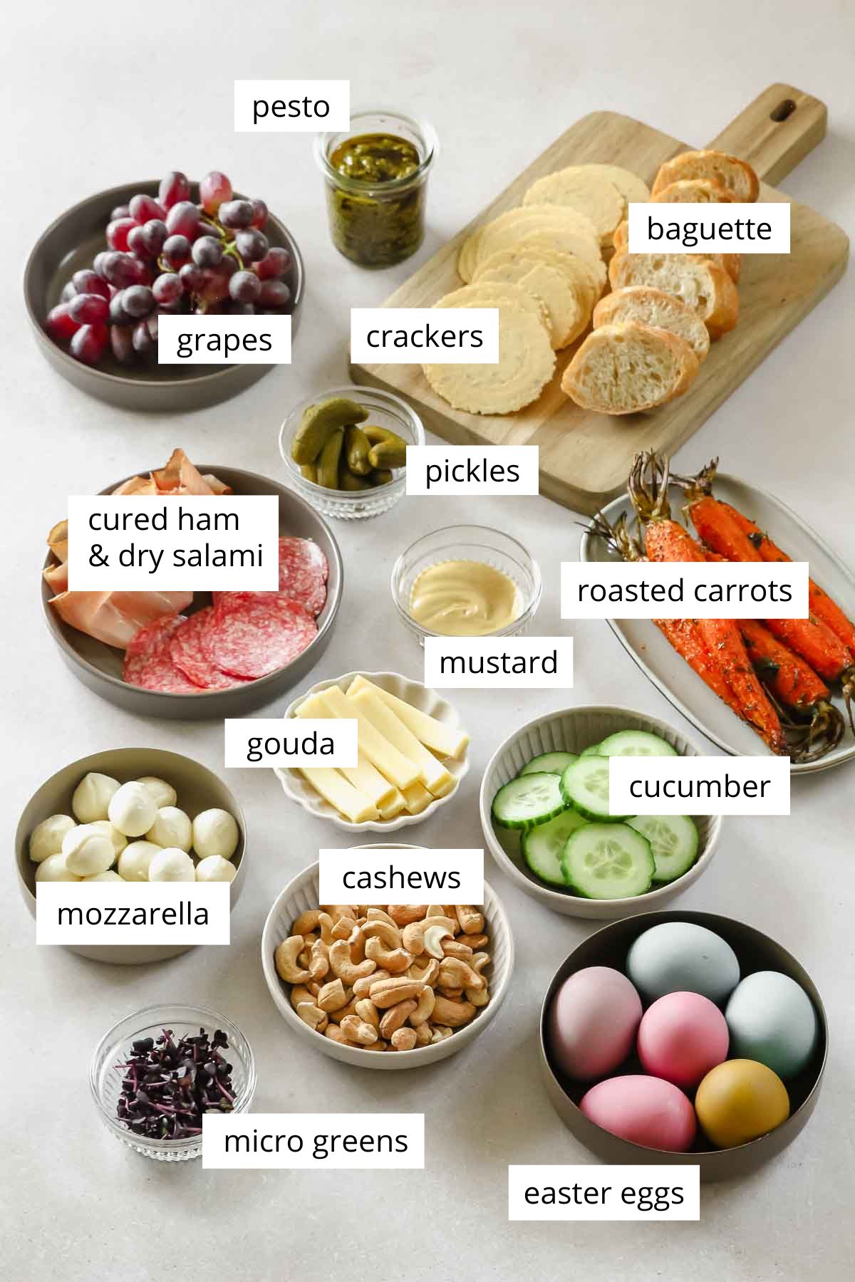 ingredients for charcuterie board on grey background.