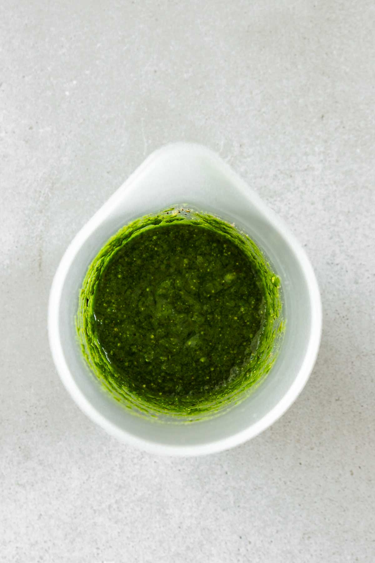 pureed wild garlic pesto in a cup.