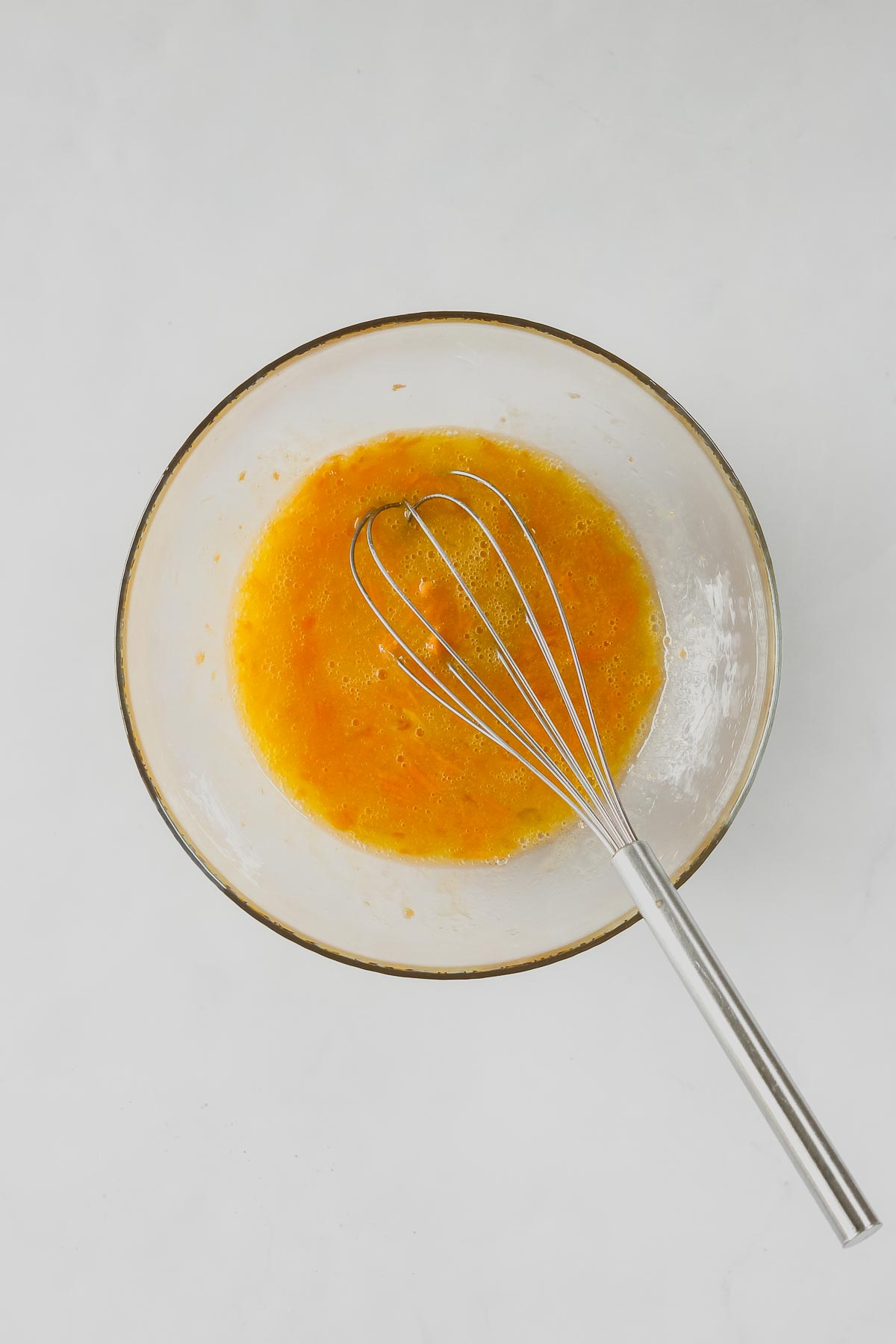 mixed wet ingredients for healthier carrot cake cupcakes.