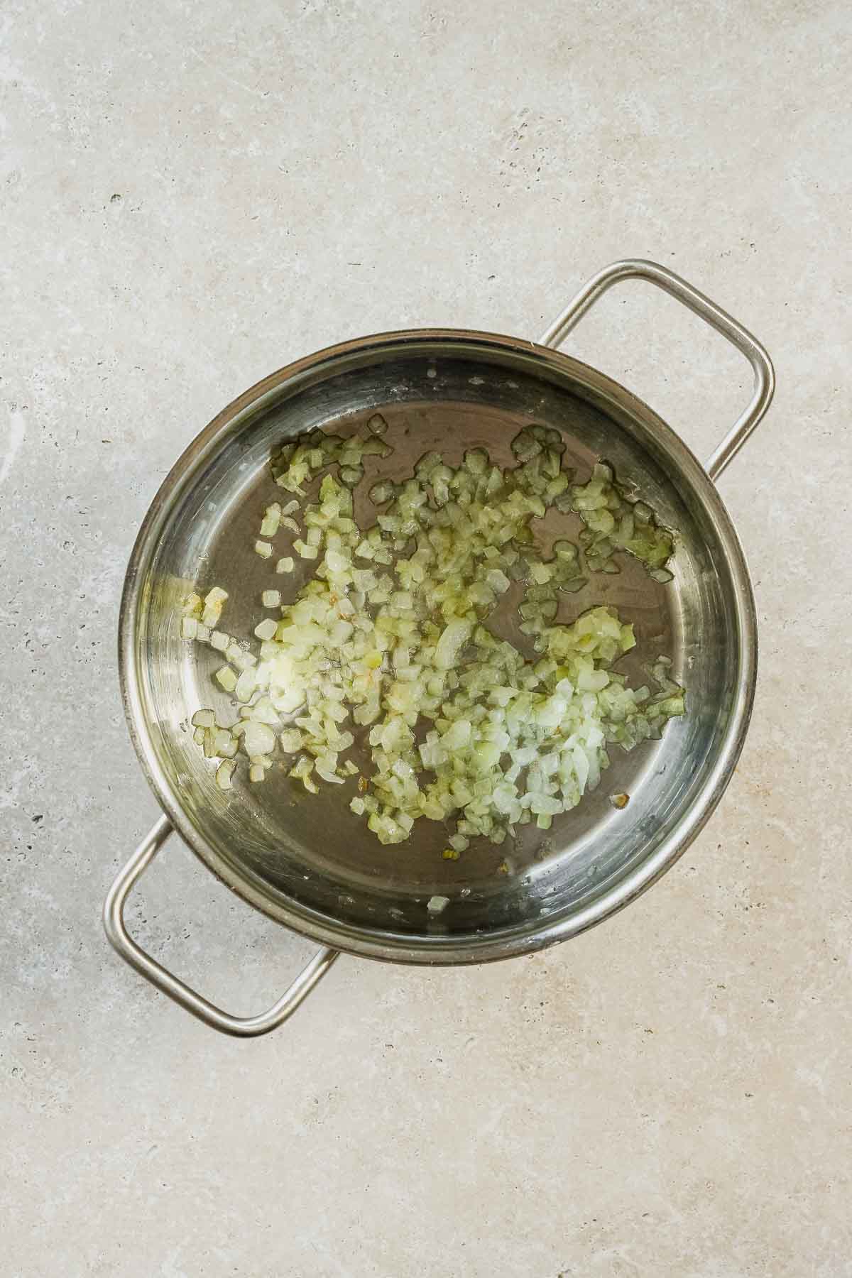 roasting diced onion in vegetable oil for soup.