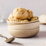 peanut butter nice cream in stacked grey bowls.