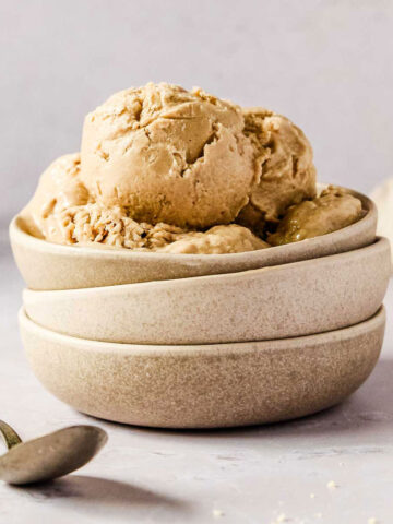 peanut butter nice cream in stacked grey bowls.