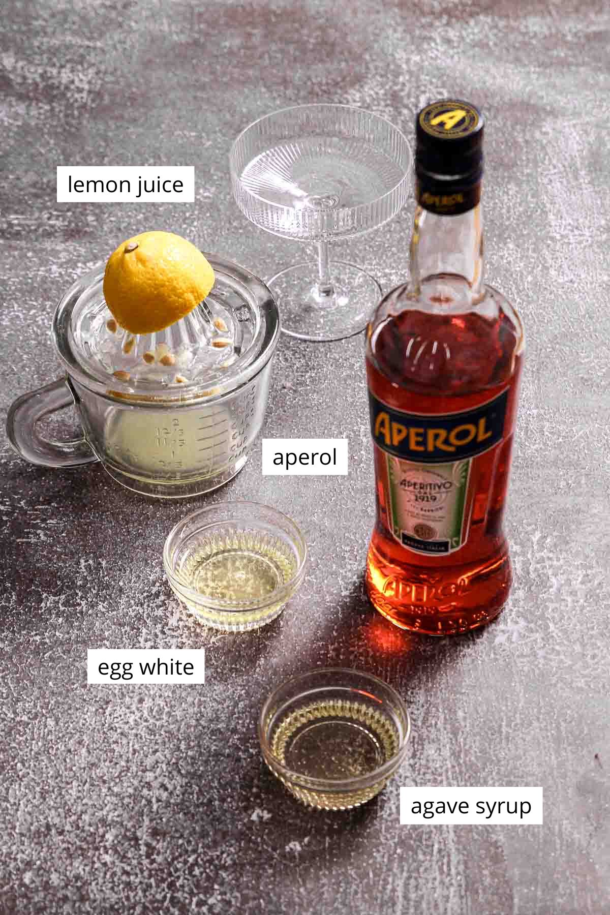 ingredients for aperol sour with labels.