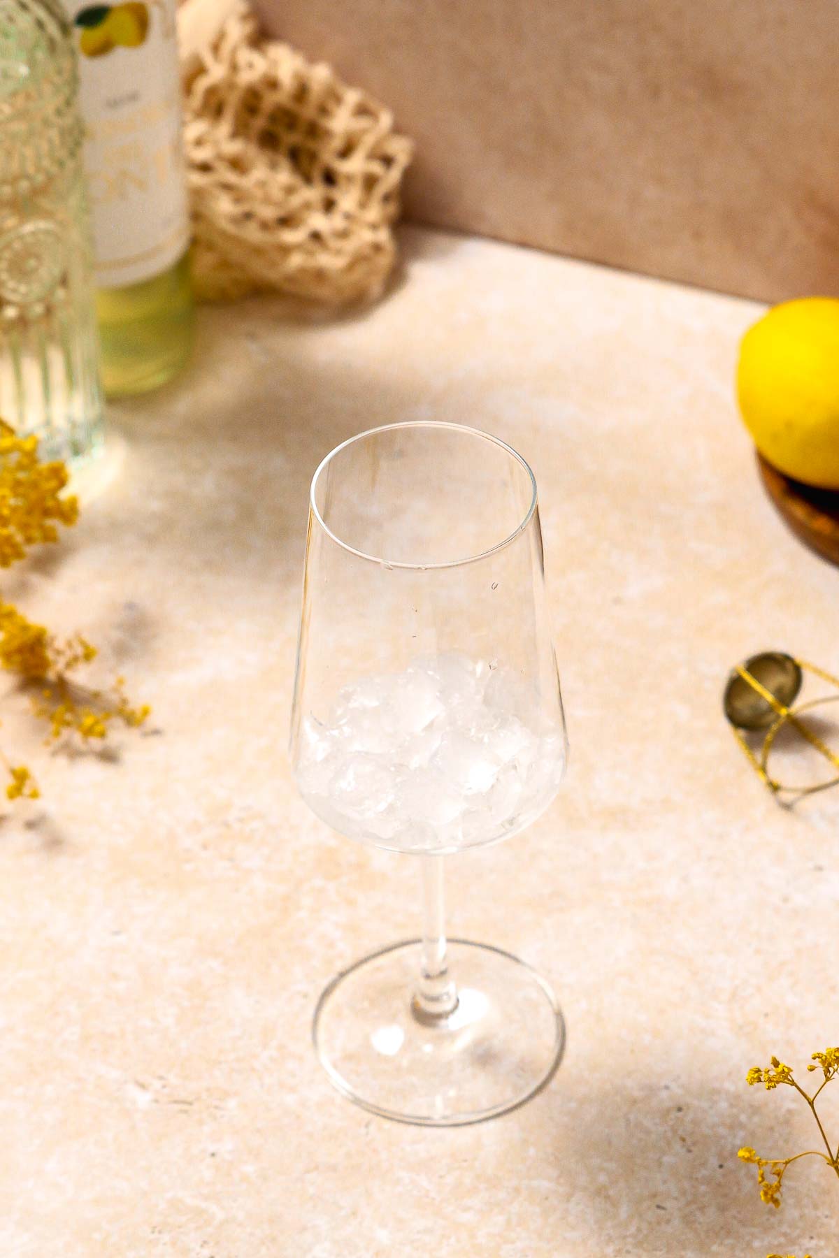 wine glass with crushed ice ready for the cocktail.