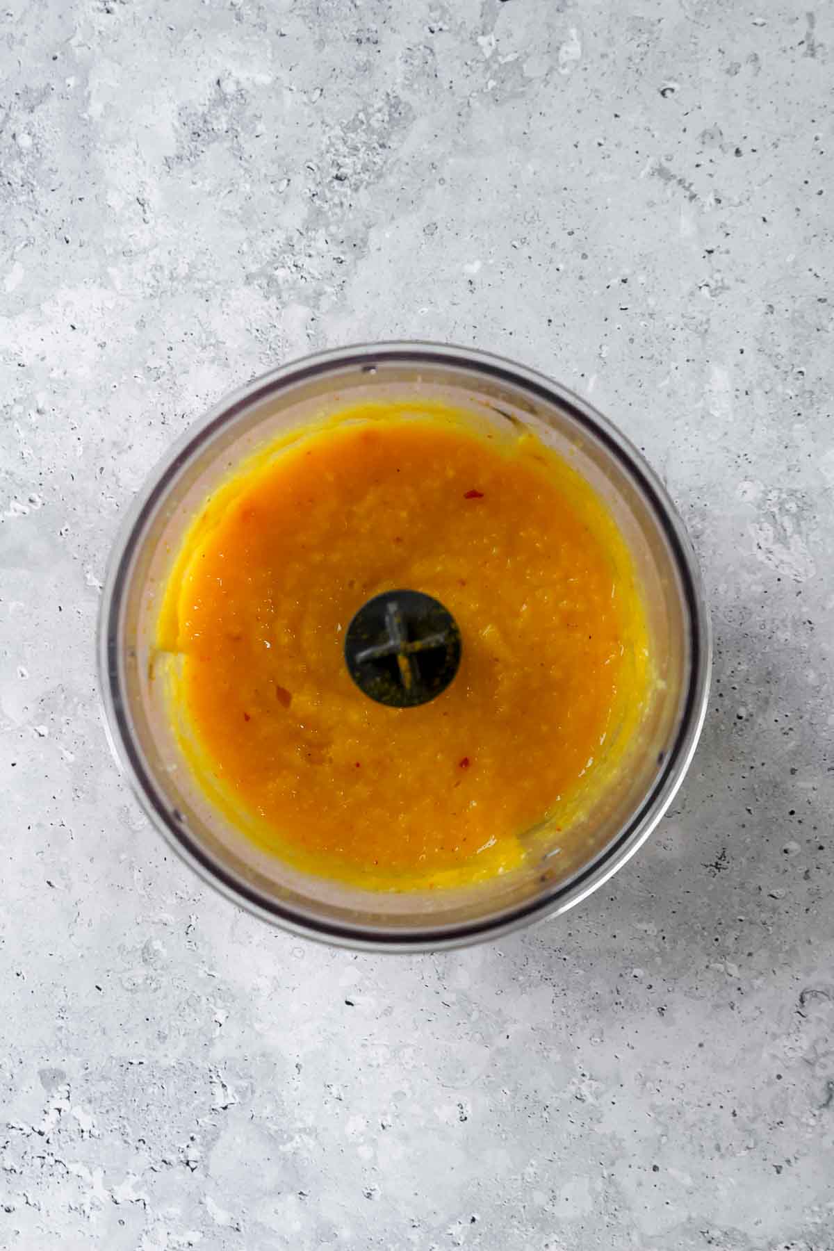 blended mango sauce in food processor.